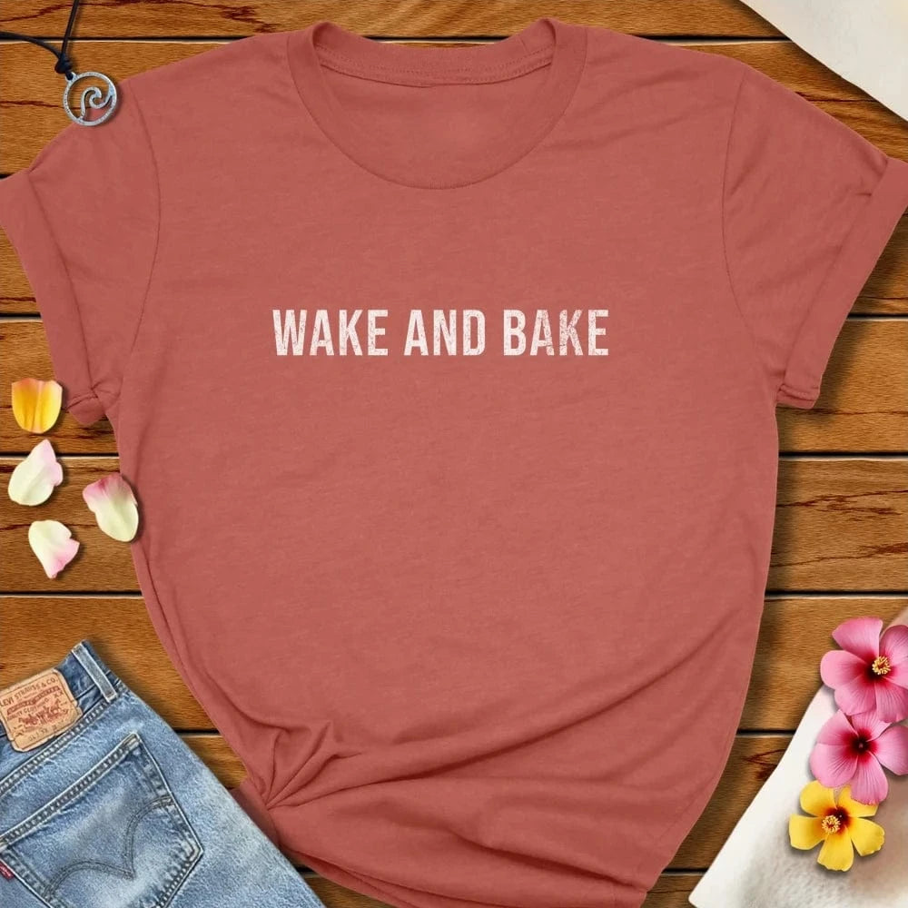 Wake And Bake Tee Heather Clay by Salty By Choice® We love the beach ocean and anything around water.