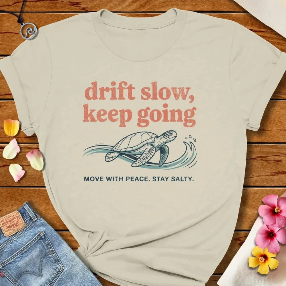 Drift Slow Tee Natural by Salty By Choice® We love the beach ocean and anything around water.
