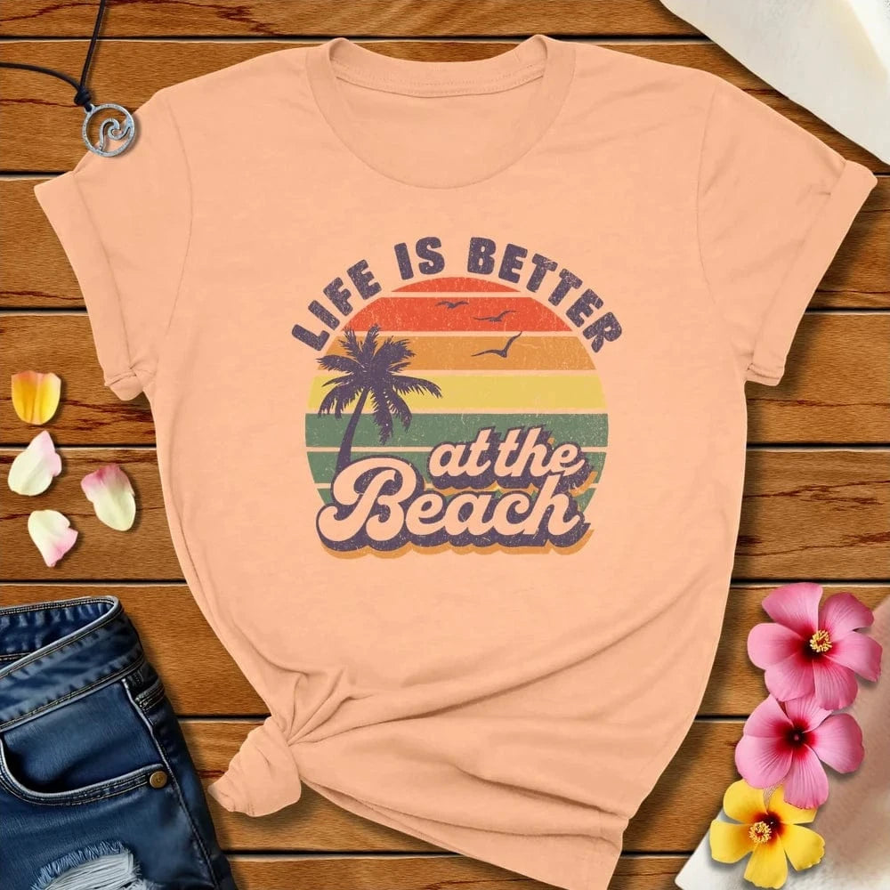 Better At The Beach Tee Heather Peach by Salty By Choice™ We love the beach ocean and anything around water.