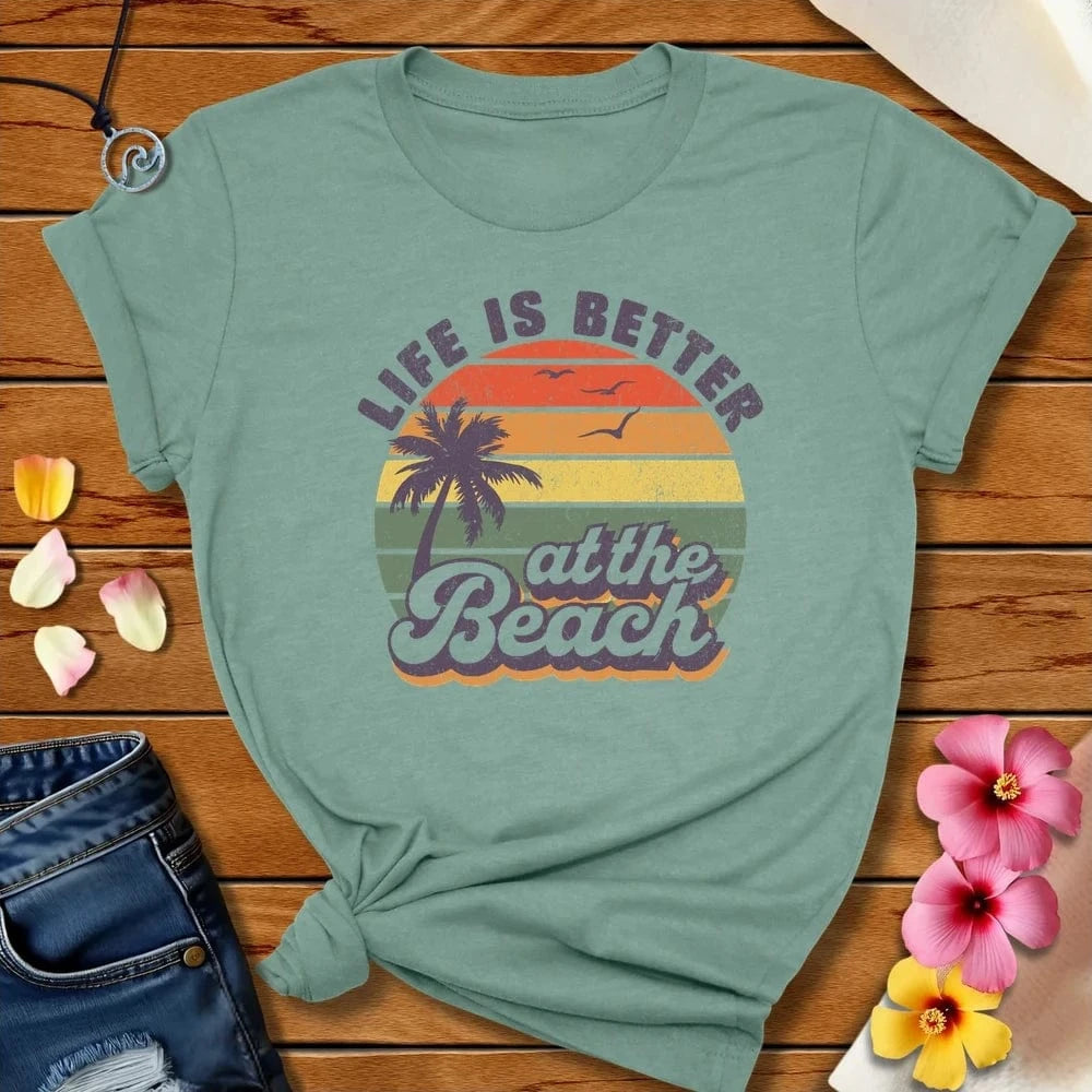Better At The Beach Tee Heather Prism Dusty Blue by Salty By Choice™ We love the beach ocean and anything around water.