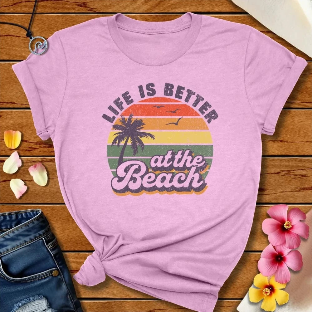 Better At The Beach Tee Heather Prism Lilac by Salty By Choice™ We love the beach ocean and anything around water.