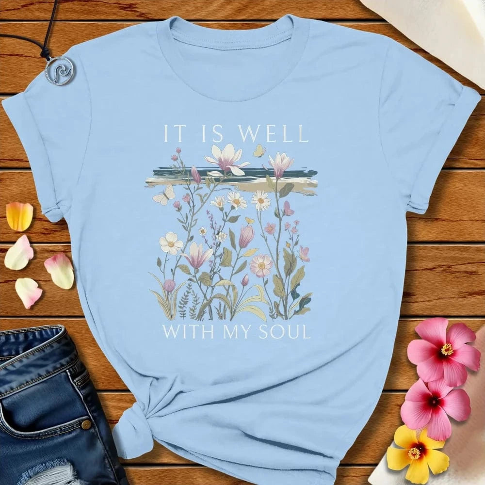 It is Well Tee Baby Blue by Salty By Choice® We love the beach ocean and anything around water.