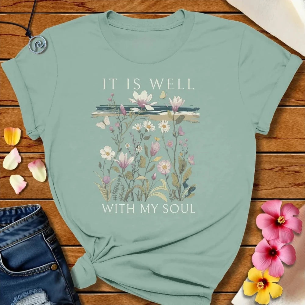 It is Well Tee Dusty Blue by Salty By Choice® We love the beach ocean and anything around water.