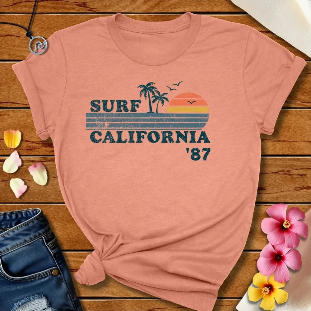 Surf Cali 87 Tee Heather Prism Sunset by Salty By Choice® We love the beach ocean and anything around water.