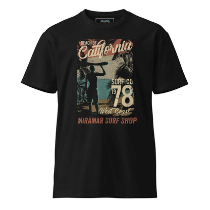 1978 Unisex Premium T-shirt.A young man stands on the beach wearing a black Miramar t-shirt. The apparel is a graphic t-shirt designed for men, available in various sizes including large and XXL. This soft tee shirt is perfect for summer, providing